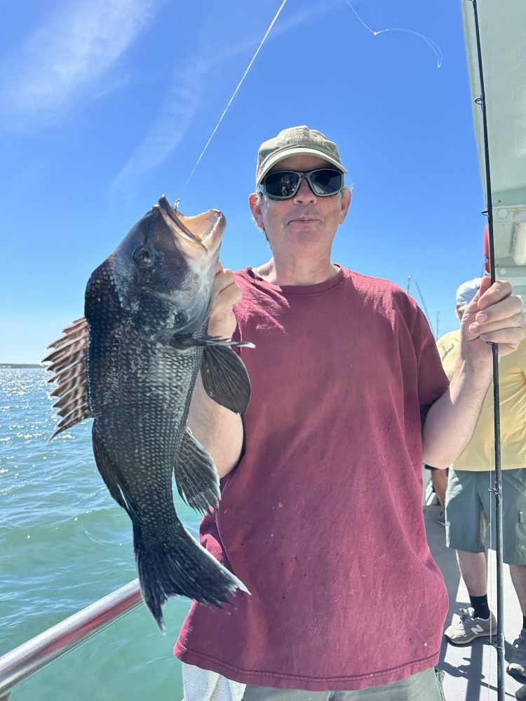 a person holding a fish