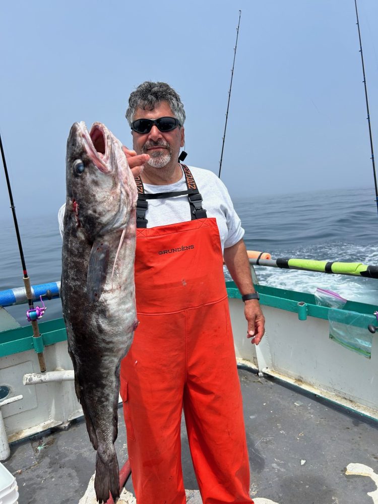 a man holding a fish