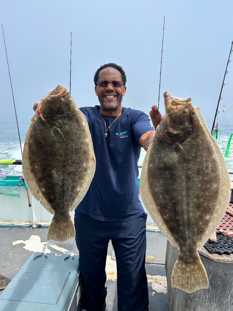 a man holding a fish