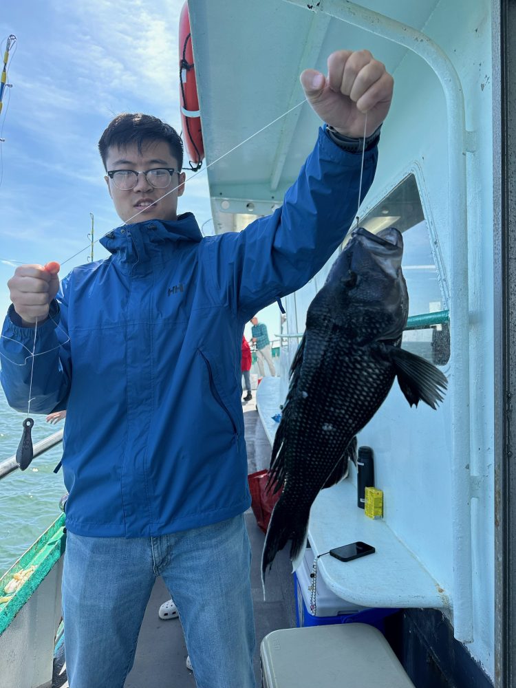 a man holding a fish