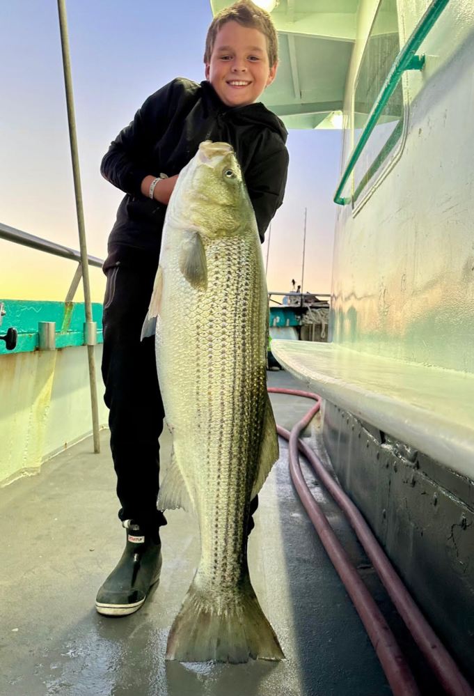 a person holding a fish