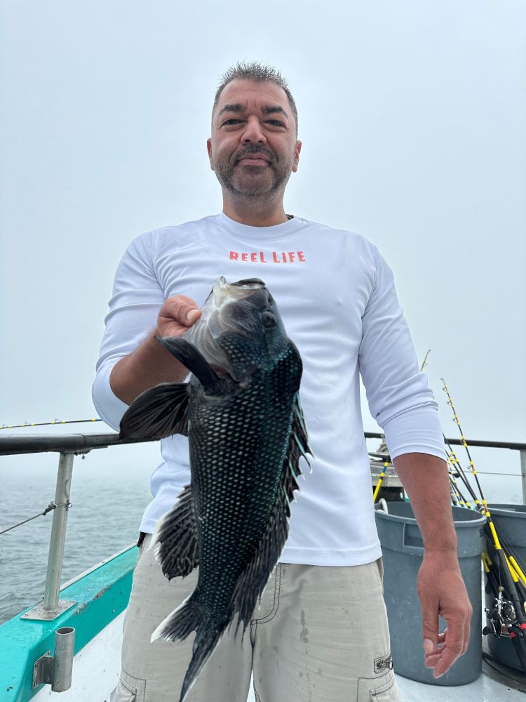 a man holding a fish