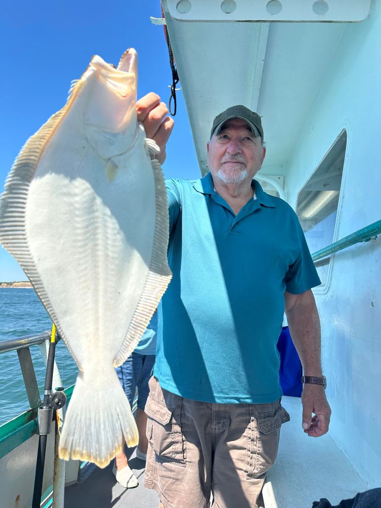 a man holding a fish