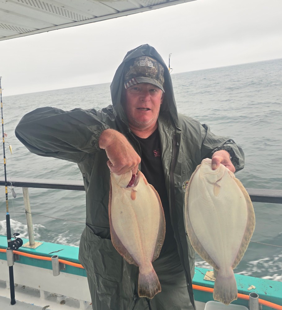 Craig Boddington holding a fish in the water