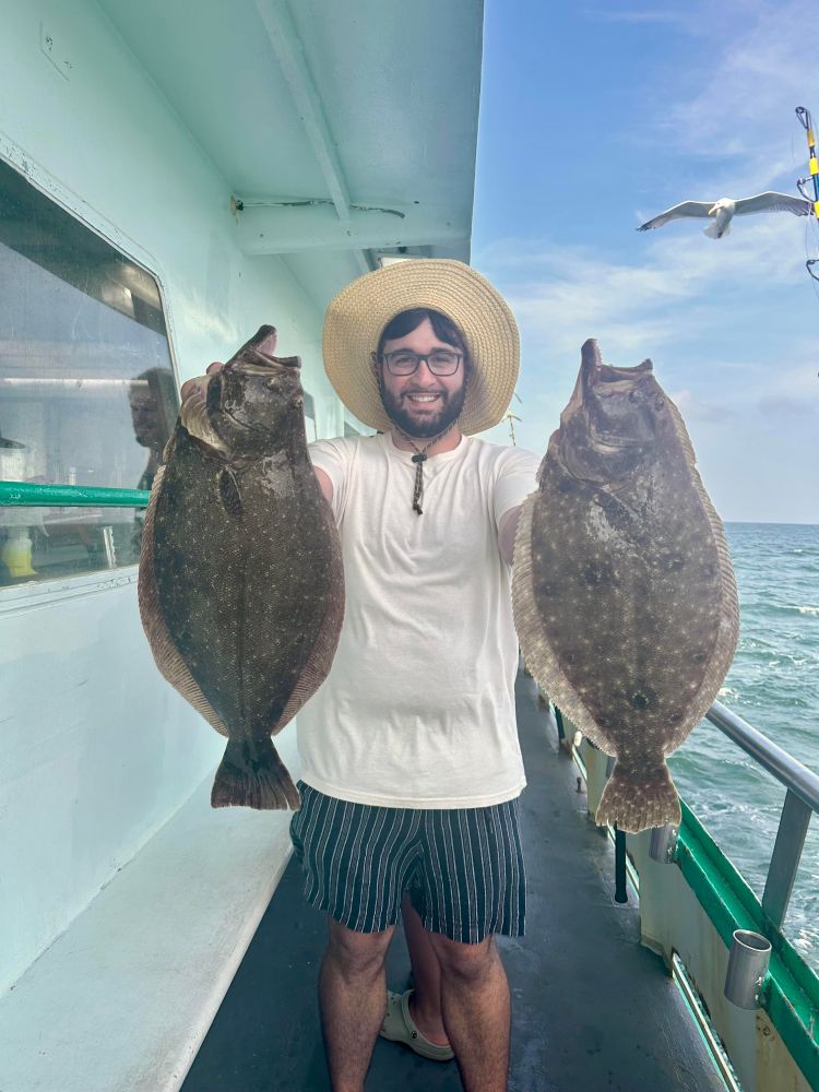 a man holding a fish