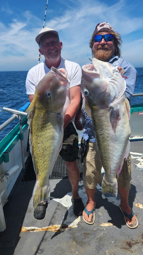 a man holding a fish