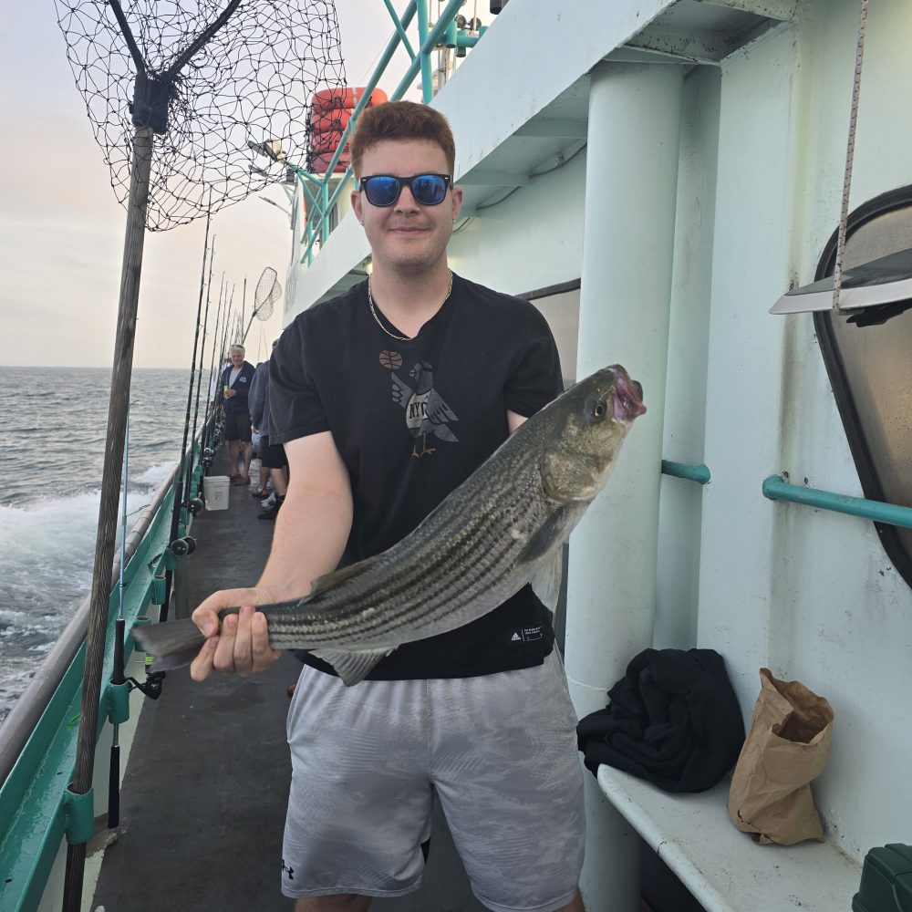 a person holding a fish