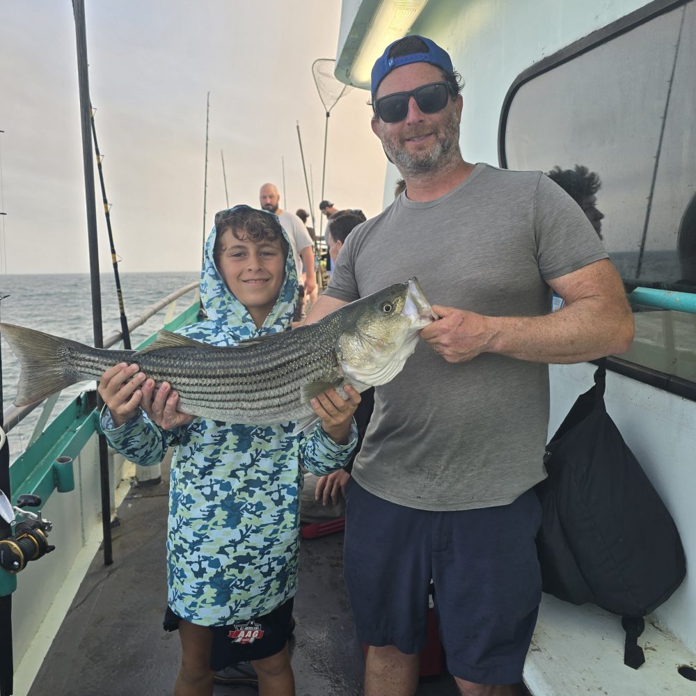 a man holding a fish