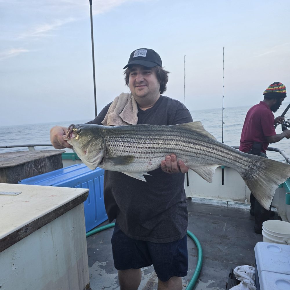 a man holding a fish