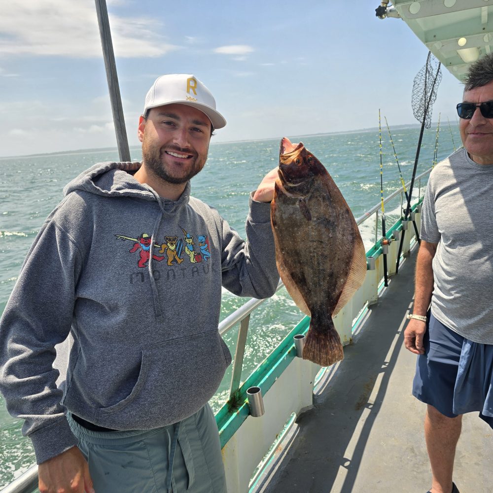 a man holding a fish