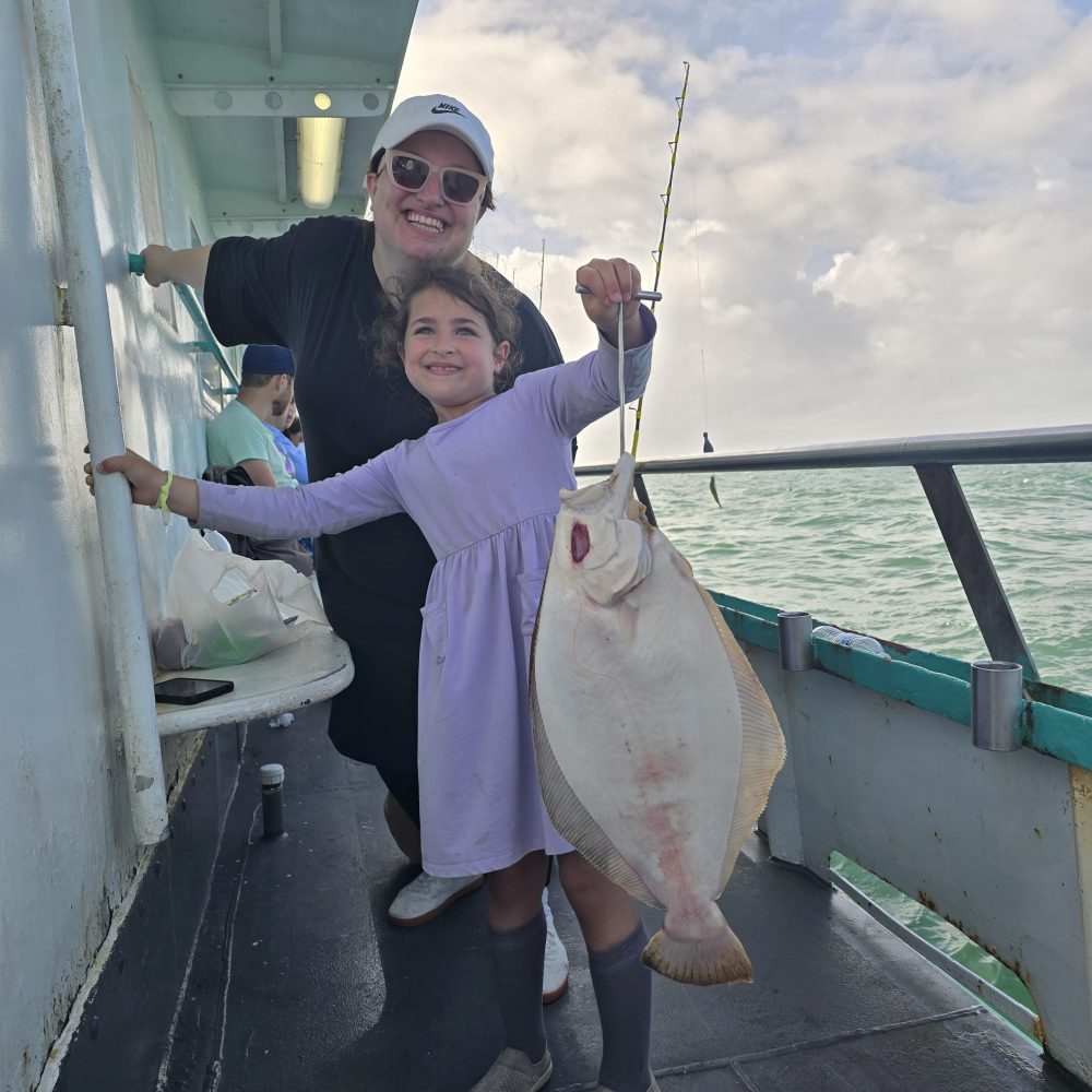 a person holding a fish