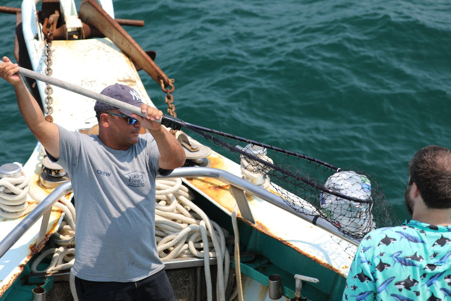 a person riding on the back of a boat