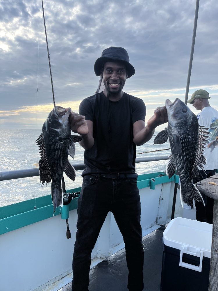 a man holding a fish