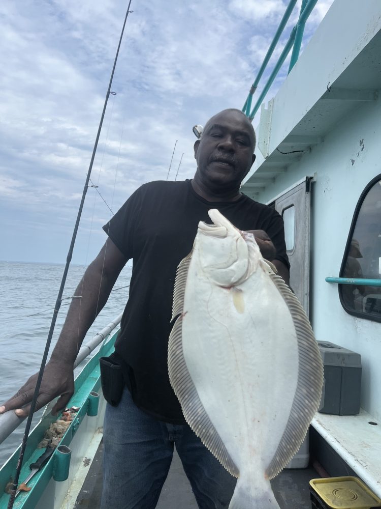 a man holding a fish