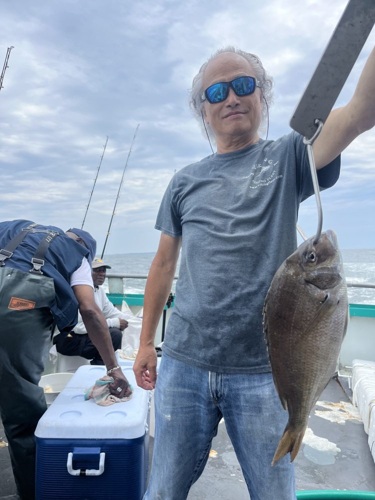 Wong Kar-wai holding a fish