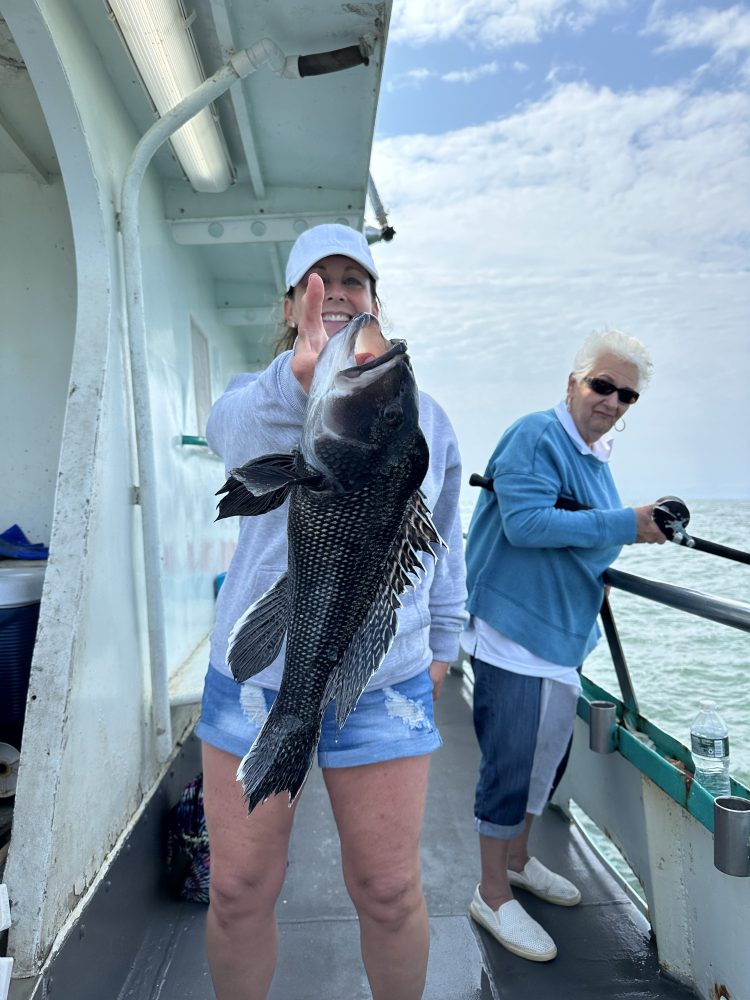 a person holding a fish