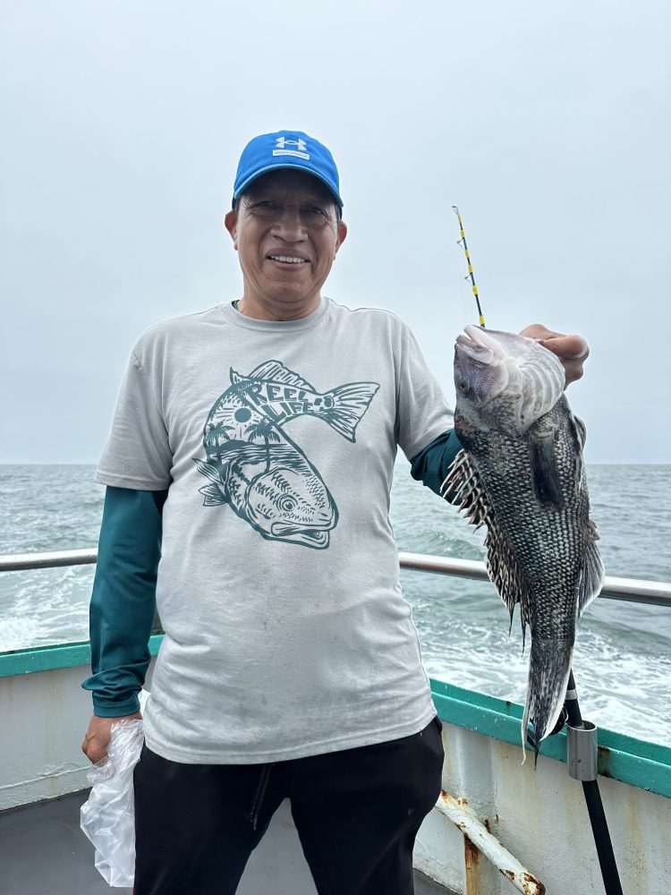 a person holding a fish