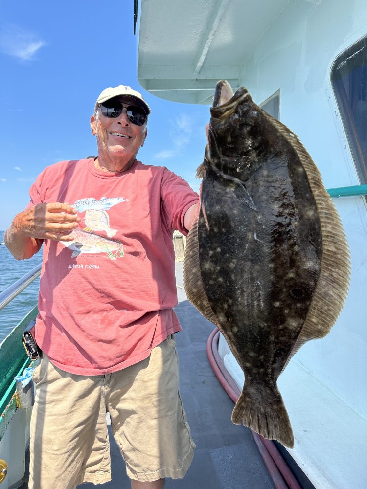 a person holding a fish