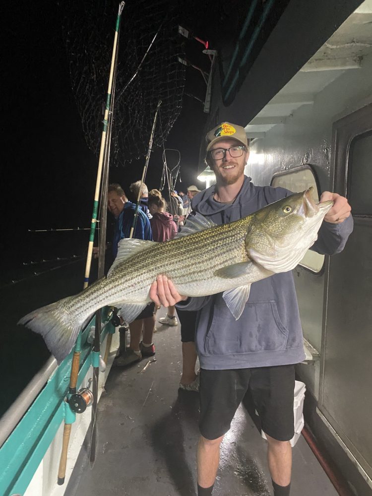 a person holding a fish