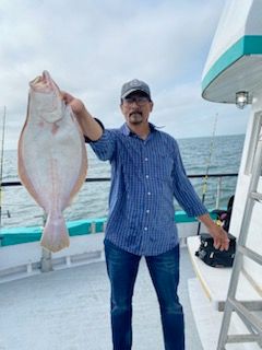 a person holding a fish