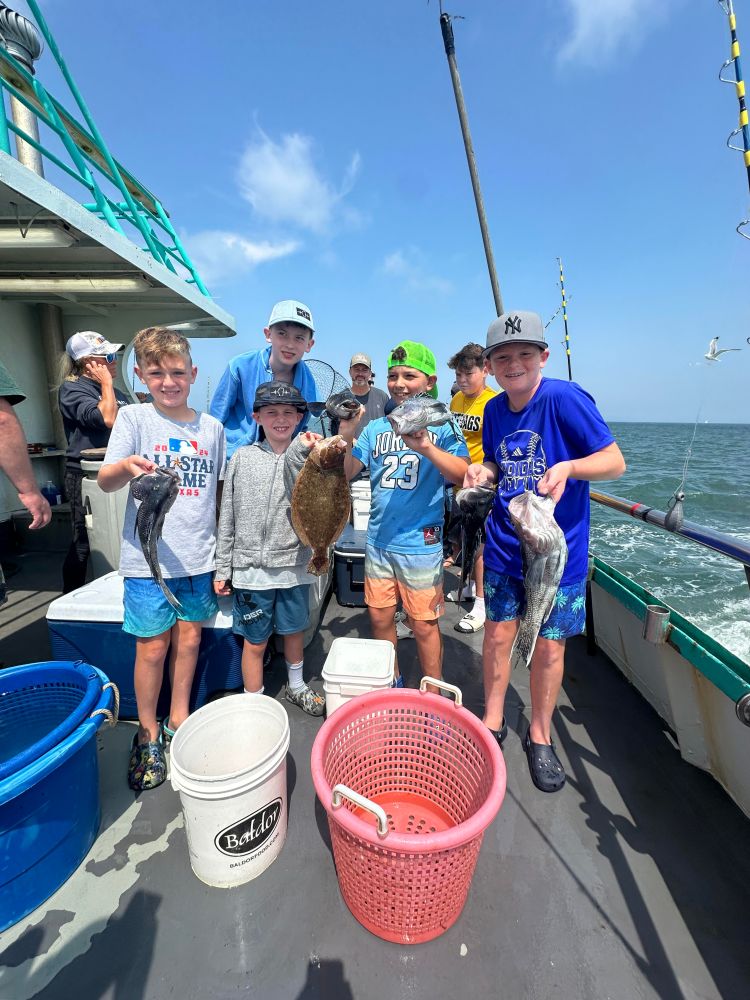 a group of people standing on a boat