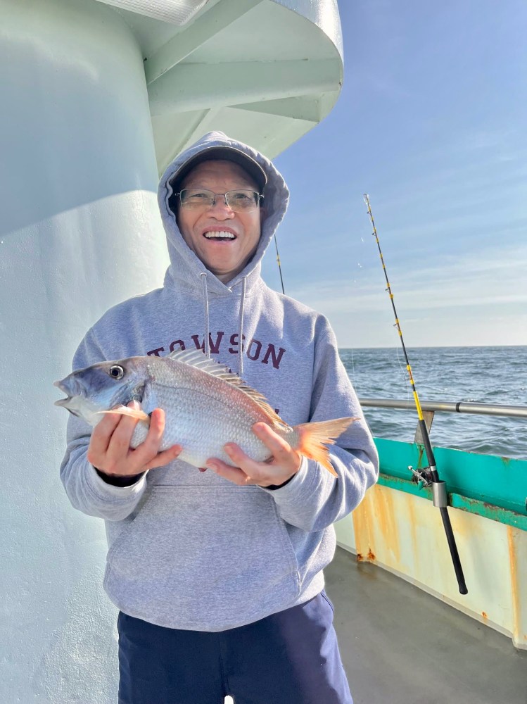 a person holding a fish