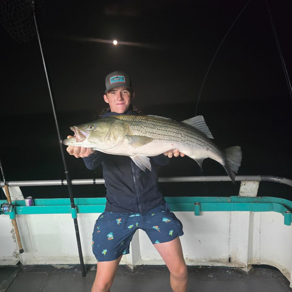 a man holding a fish