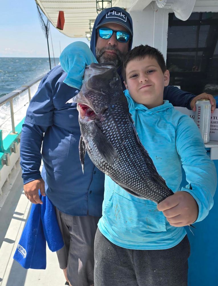 a person holding a fish