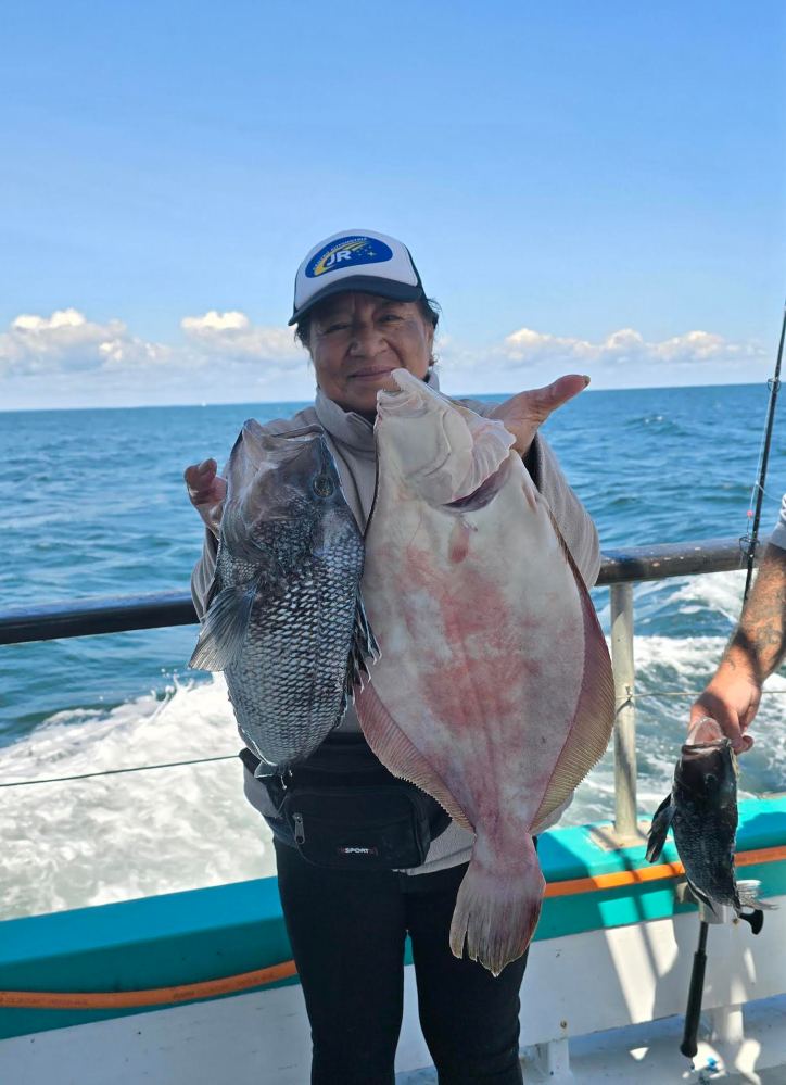 a person holding a fish in the water