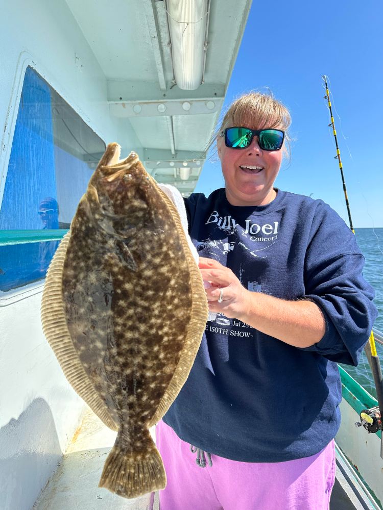 a person holding a fish