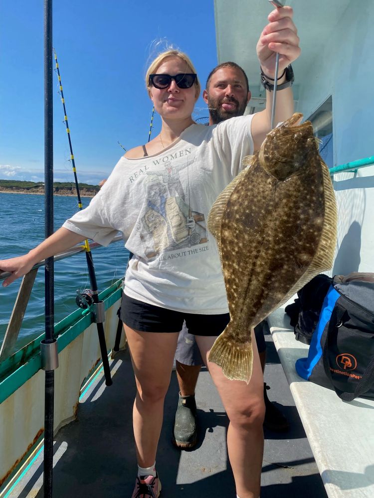 a person holding a fish