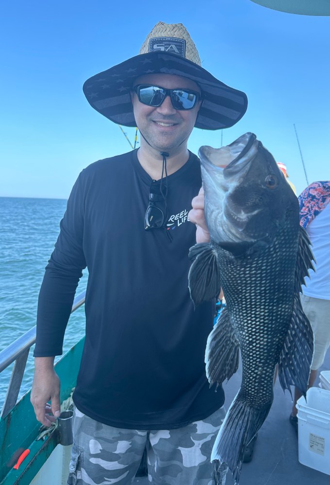 a man holding a fish