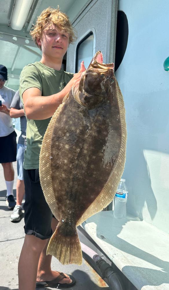 a person holding a fish