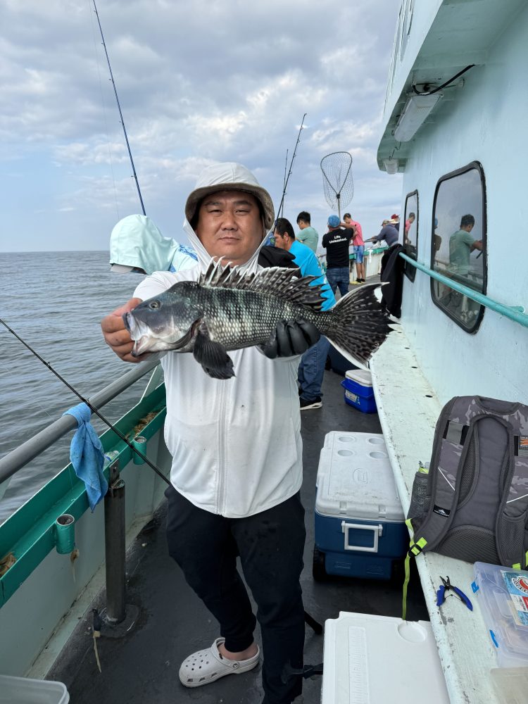 a person holding a fish in the water