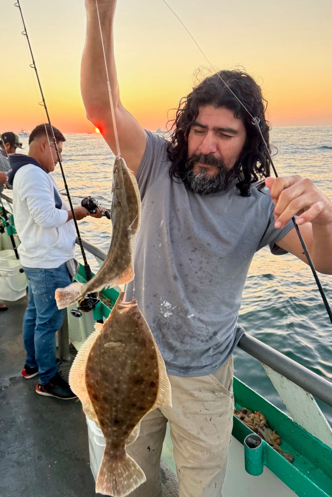 a person holding a fish