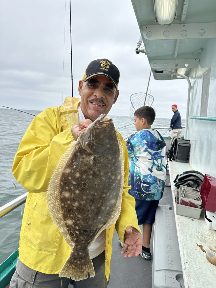 a man holding a fish