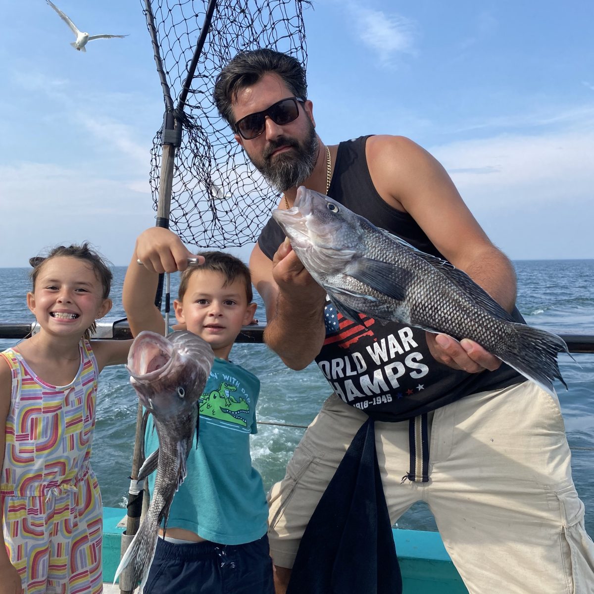 a group of people standing next to a body of water