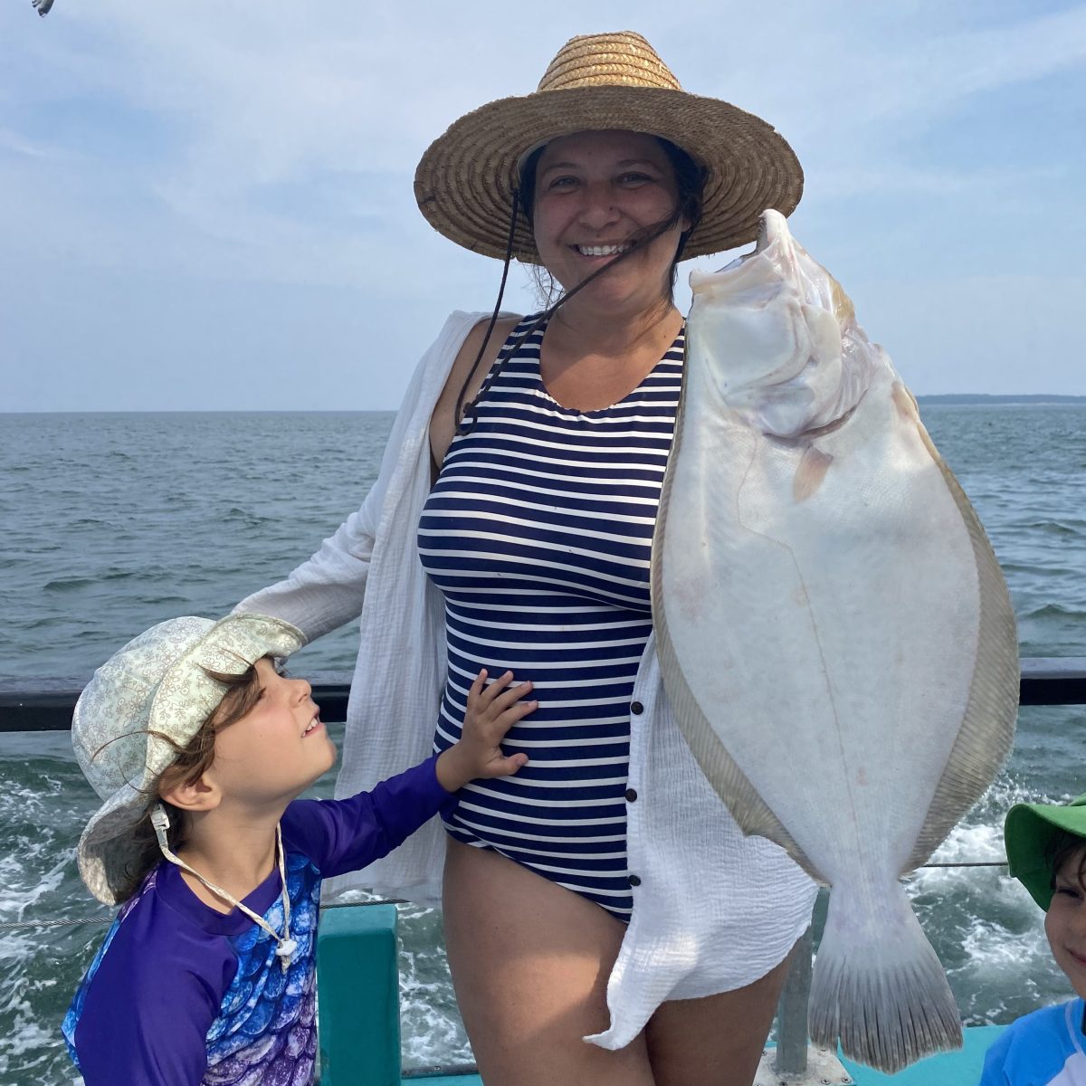 a person standing next to a body of water