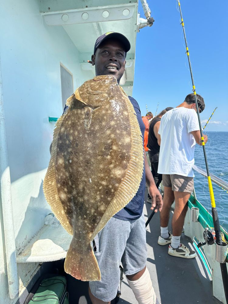 a man holding a fish