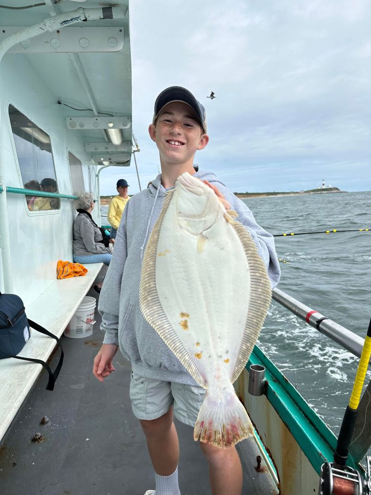 a person holding a fish