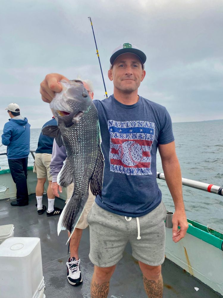 a man holding a fish