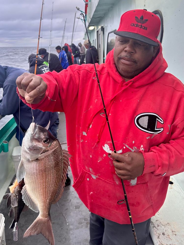 a person holding a fish