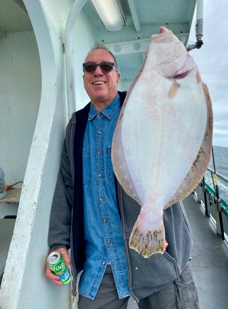 a man holding a fish