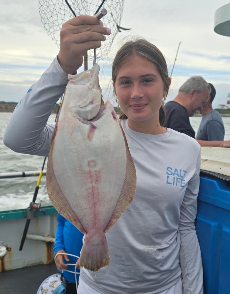 a person holding a fish