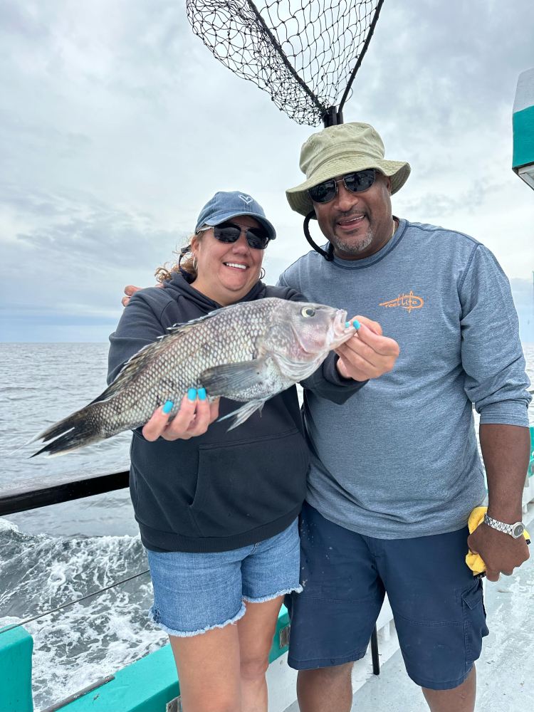 a person holding a fish