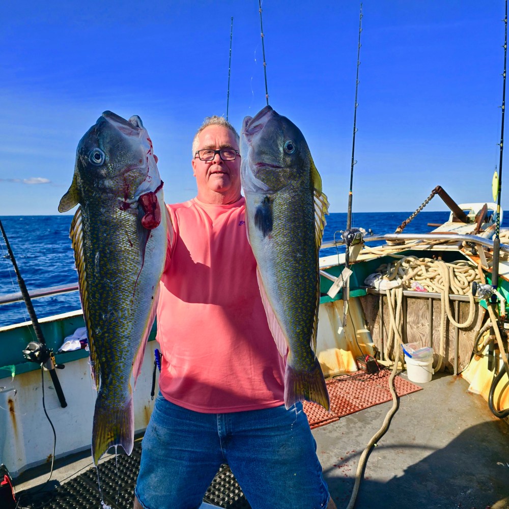 a person holding a fish