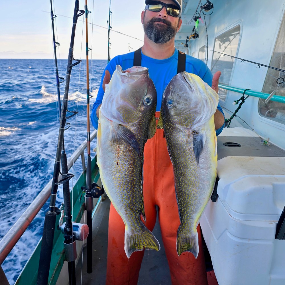 a man holding a fish