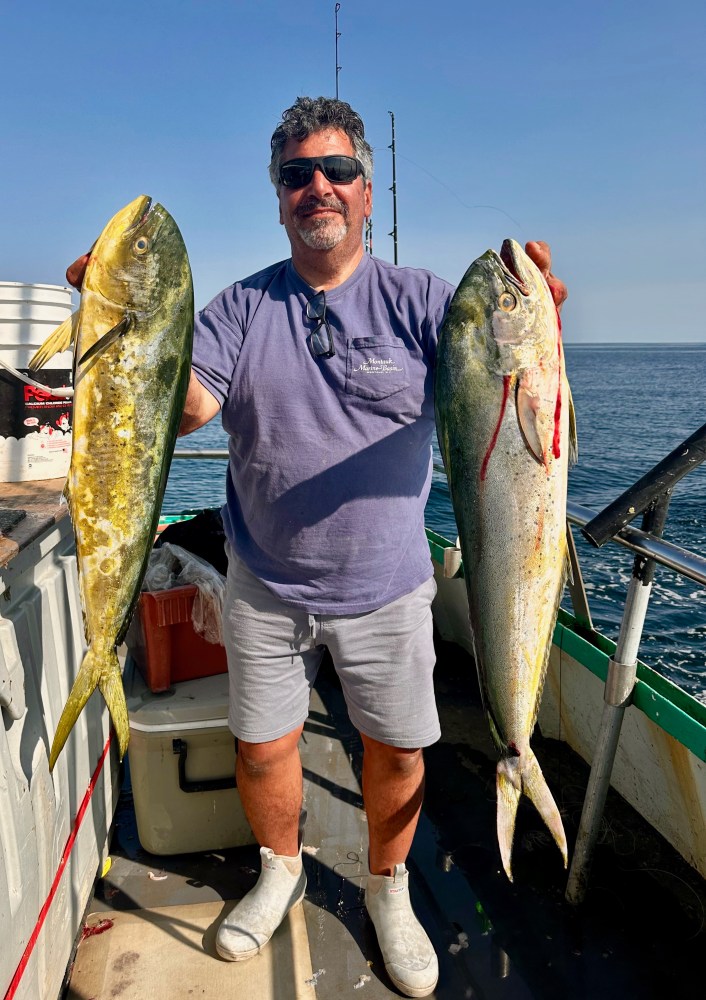 a man holding a fish