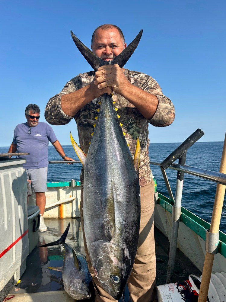 a man holding a fish