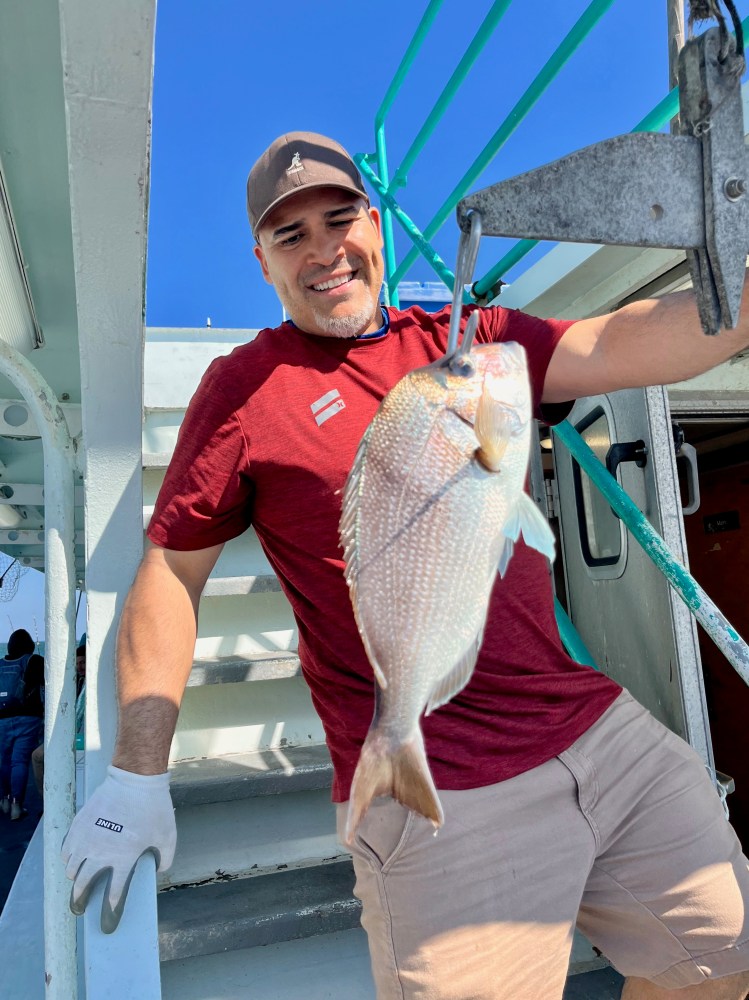 a person holding a fish